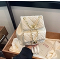 Quilted cream leather backpack featuring golden chain straps and turn-lock closure - Large / Off White