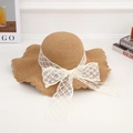 Straw sun hat in wood color featuring wavy wide brim and white lace mesh bow detail - Lace Diamond Khaki