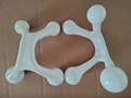 White five-row plastic handheld roller massager for relaxation and muscle relief - Four-legged Massager White