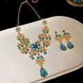Set gioielli vintage con cristalli blu a goccia e collana floreale dorata donna - Set da 2 pezzi (Collana + Orecchini) / Blu