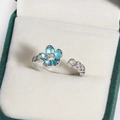 Detailed macro view of silver flower open ring with blue enamel and zircon inlay - Sky Blue Five-Petal Flower (White Gold Tone 12)