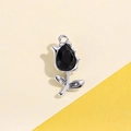 Macro shot of silver tulip pendant with black teardrop gem and top hanging ring loop - Color-Preserved Black Tulip