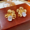 Vintage gold flower stud earrings with a teardrop gemstone on brown leather background - Real Gold Plated Silver Earring Post Zircon Flower Earrings