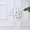 White latex party balloon with black paw prints on a white stick for kids events - 12 Inch Dog Paw Latex Balloon