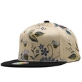 Close-up of a satin snapback hat with floral embroidery and a contrast black flat brim - Rice Gold Ethnic Embroidery Style (11)