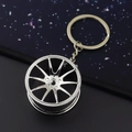 Silver metallic alloy car wheel rim keychain with multi-spoke design and polished finish - 37mm Silver Wheel Rim