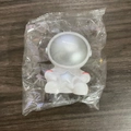 White astronaut night light figurine with silver visor in a transparent plastic bag - Small Astronaut Silver Star