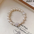 French vintage pearl bracelet with zircon square pendant and heart charms on linen - Silver