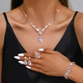 Elegant rose gold bridal jewelry set with sparkling teardrop crystal necklace and earrings - 5017464.4-5 4-Piece Set / Rose Gold