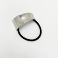 Elastic black hair tie featuring a silver textured metallic bow accent on white background - Diagonal Rhombus Brushed / Silver