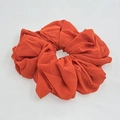 Close-up of vibrant orange chiffon scrunchie showing soft fabric texture and pleats - Orange Red (3-1)