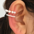 Detail of gold pearl ear cuff set showing different sizes worn on the ear cartilage - White Artificial Pearl Ear Cuff Set (DZ-521)