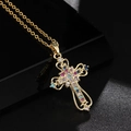 Golden cross necklace with colorful zircons on black reflective background - Gold Colorful Zircon Cross (Style 62)