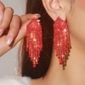 Sparkling red rhinestone long tassel earrings shown on model with geometric luxury design - Red Waterdrop Tassel Full Rhinestone
