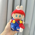 Labubu doll in red rabbit hoodie and blue plush overalls with red mushroom bag - Handmade Mushroom Bag Set / First And Second Generation Keychains Are Compatible With La Cloth Dolls. Dolls Not Included.