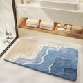 Saugfähige Badematte mit blau-beige Wellenmuster auf modernem Badezimmerboden - 50*80cm / Meeresblick