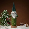 Gnome wine bottle cover with green felt and black-green plaid hat in snowy scene - Green
