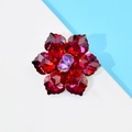 Elegant floral brooch with deep red faceted petals and purple crystal center accent - Double Red