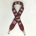 Close-up of red and black diamond pattern wide bag strap with gold lobster clasps - Red Diamond Wine Red Leather Gold Hook