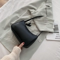 Minimalist black baguette shoulder bag in smooth faux leather with modern slim design - Black