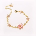 Elegant gold flower bracelet featuring pink teardrop zircons and delicate leaf accents - Gold-Pink