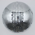 Close-up of a silver mirror disco ball with reflective glass tiles on light grey background - 20cm Key Ring Buckle