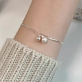 Double-layered S925 silver snake chain bracelet featuring a white freshwater pearl and bead - 925 Silver / Silver