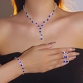 Sparkling silver jewelry set with blue gems worn by a model including necklace and earrings - Blue-Silver Three-Piece Style (DTN14026534-3S-BU)