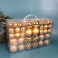 Coffret de 100 boules de Noël dorées avec finitions pailletées et ajourées en boîte - Boîte PVC de 100 pièces (Or)