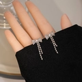 Silver bow tassel earrings with sparkling rhinestones and elegant white pearls - E4975-1 Silver Bow Triple Tassel