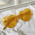 Retro amber heart-shaped oversized sunglasses with rimless lenses on white fabric - One-piece Heart Orange