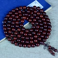 Classic 108 sandalwood prayer beads with traditional tassel on a blue decorative book - High Density Old Material Mala Style / 12mm*108 Beads