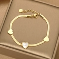 Gold stainless steel flat snake chain bracelet with shell heart pendants on a jewelry box - Gold White Shell Heart (BR-19)