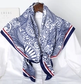 Blue and white paisley silk scarf with red striped borders draped over a white shirt - Navy Blue Blue and White Porcelain