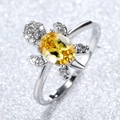 Silver turtle ring featuring a large oval yellow gemstone and white zircon accents - Yellow Zircon