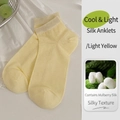 Pale yellow silk socks featuring breathable seamless design and smooth cooling texture - One Size / Bright yellow