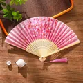 Pink Chinese folding fan with cherry blossom pattern and pink tassel on bamboo frame - 06 Faint Fragrance