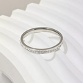 Detailed close-up of a silver-tone titanium steel ring with single-row stone inlay - Size 5 / Single Row Rhinestone (2.5mm) / Silver