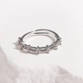 Close-up of adjustable silver ring with wavy texture and white cubic zirconia stones - Micro-pave Cross Star Style / White Gold