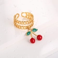 Detail shot of golden Cuban chain ring with red enamel cherry charm and open band - Double Cuban Link Style (J-20022)