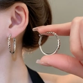 Silver oval hoop earrings with textured geometric facets and a polished finish - Silver Textured 3D Cut Style (108#)