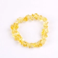 Handmade natural yellow quartz crystal stone chip bracelet with elastic cord on white background - Yellow Glass