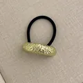 Elastic hair tie with hammered gold cylindrical metal accent in minimalist design - Large Single Layer Wrinkle Gold