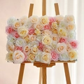 Artificial cream pink rose flower wall panel displayed on a wooden easel for wedding decor - Full Rose Champagne Pink