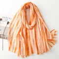 Orange gradient linen-feel scarf with gold foil details and fringe edges on a white background - Orange