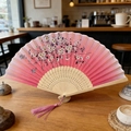 Pink gradient silk folding fan with cherry blossom pattern and matching tassel - Pink Sakura Gradient