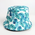 Reversible bucket hat with tropical coconut tree leaves print for sun protection - M (56-58cm) / Blue Green Tropical Leaves Print