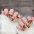 Amber gradient press-on nails with champagne diamonds on light grey wood background - 1403-Ice Amber Orange / Extra Small (XS)