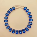 Detail of royal blue rectangular crystal choker with elegant gold-tone metal settings - Deep Sky Blue