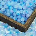 Macro shot of 10mm blue-purple gradient glass beads with matte finish in a wooden tray - 10mm / N12# Blue Purple (10MM)